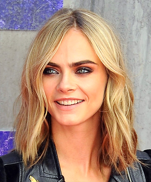 Cara Delevingne camouflages her forehead with off-center peek-a-boo part