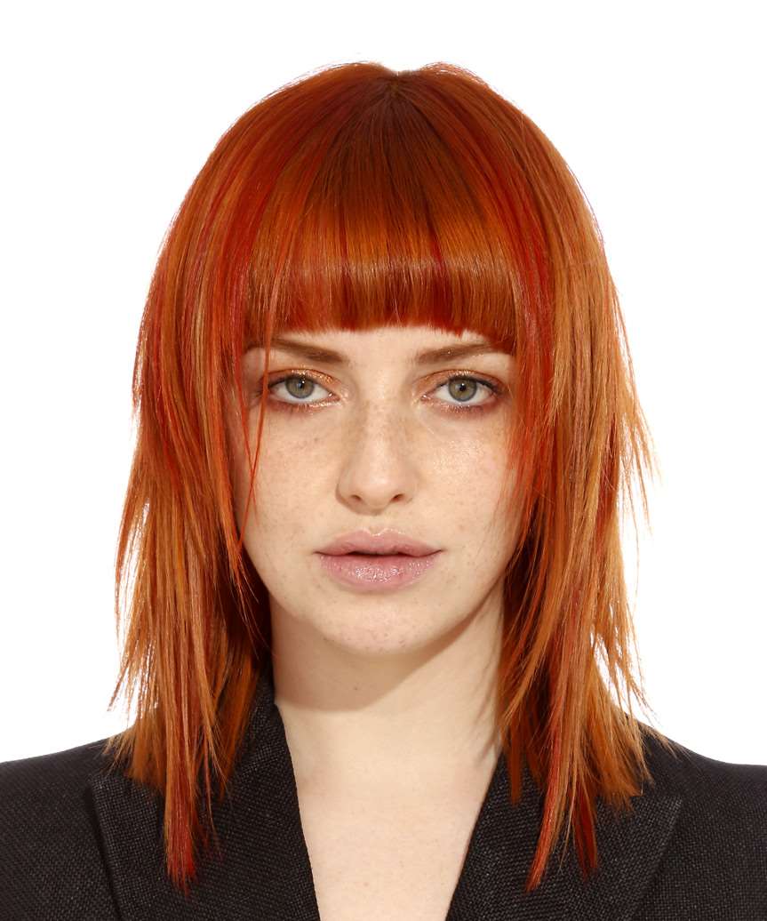 medium straight orange hairstyle with blunt cut bangs