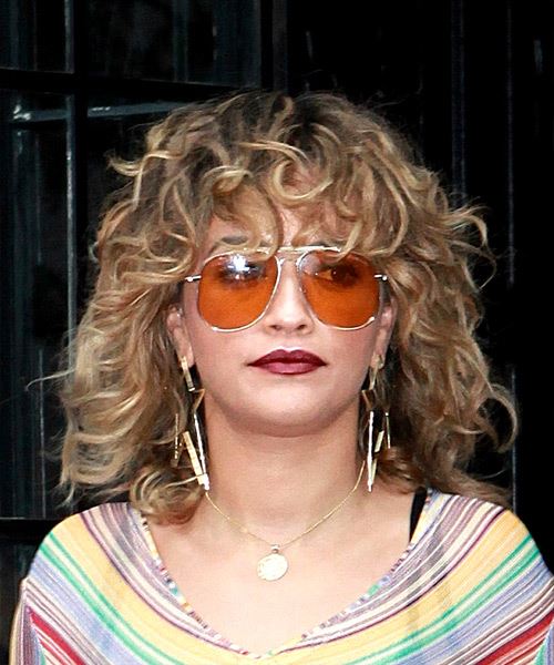 Rita Ora Medium Curly Light Brunette Shag Hairstyle with Layered Bangs