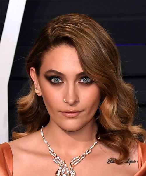 Paris Jackson Medium Wavy Layered   Brunette Bob  Haircut with Side Swept Bangs  and  Blonde Highlights