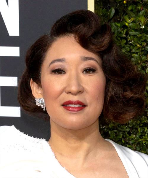 Sandra Oh Short Curly   Black  Bob  Haircut with Side Swept Bangs  and Dark Brunette Highlights