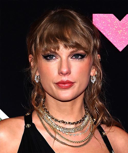 Taylor Swift Half-Up Hairstyle With Messy Bangs And Subtle Curls