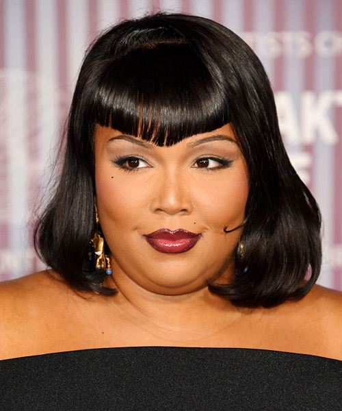 Lizzo Shoulder-Length Hairstyle With Triangle Bangs - side view
