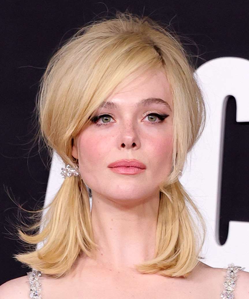 Elle Fanning Youthful Hairstyle With Low Pigtails