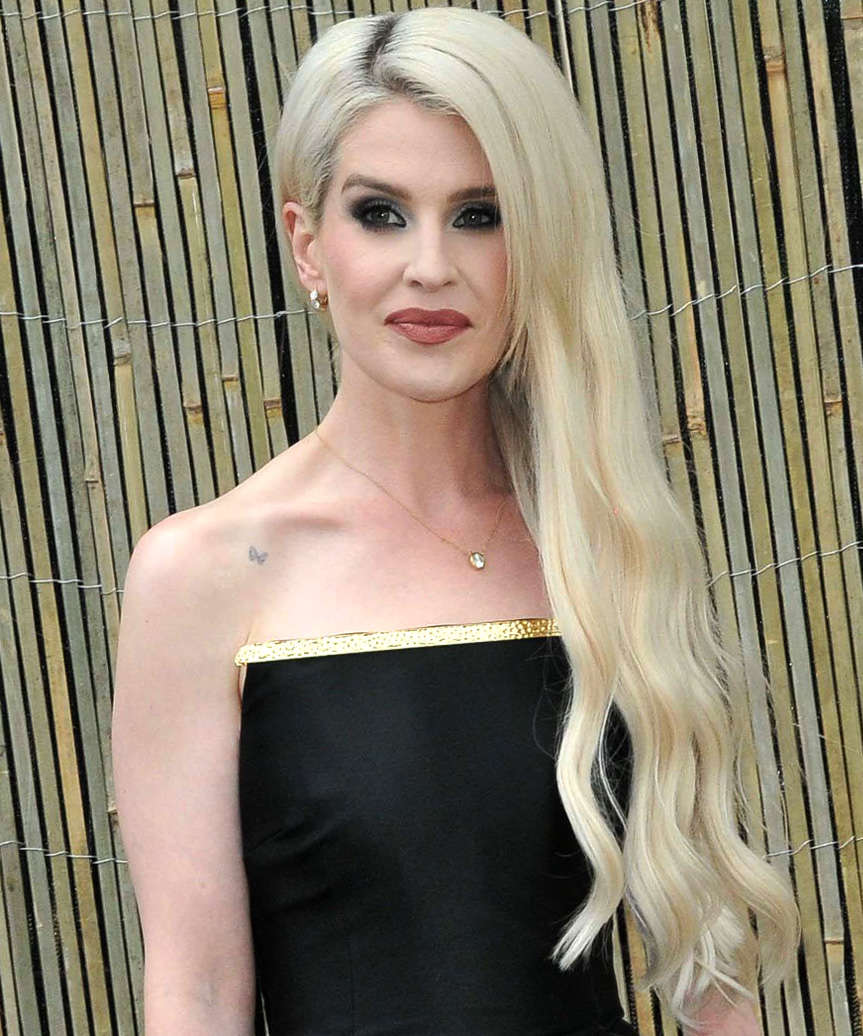 Kelly Osbourne Long Side-Swept Hairstyle With Gentle Waves