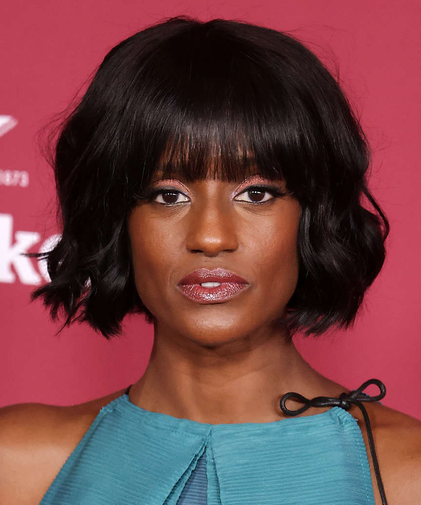 Skye P. Marshall Choppy Chin-Length Micro Bob Haircut With Blunt Bangs And Curls