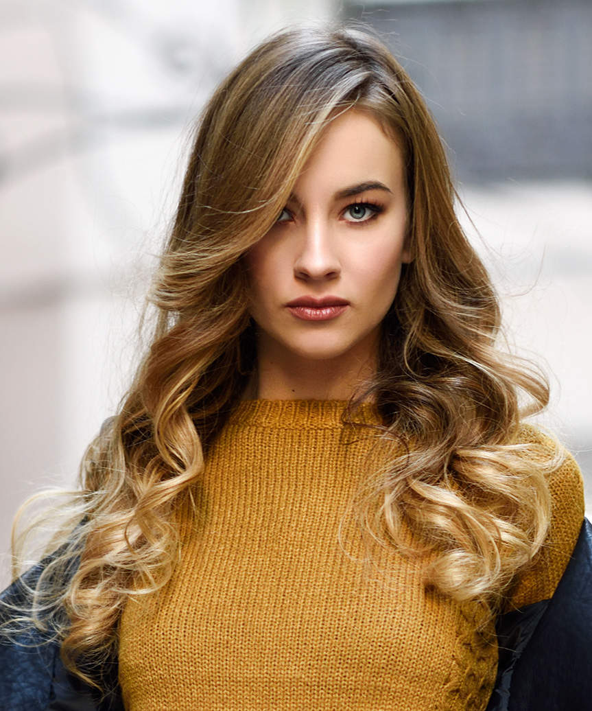 Long Hairstyle With Side-Swept Bangs And Gentle Curls