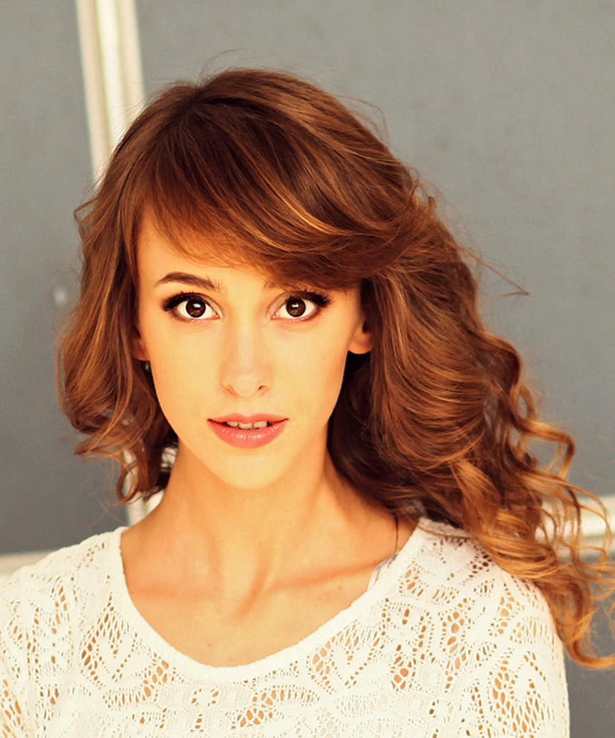 Long Hairstyle With Loose Curls And Side-Swept Bangs