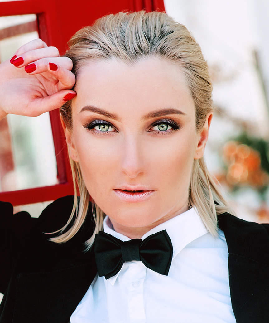 Slicked-Back Medium-Length Wet-Look Hairstyle