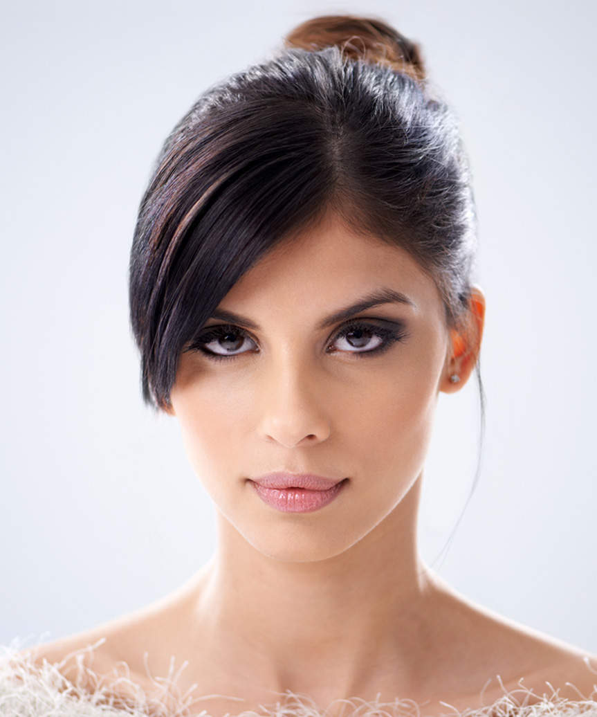 Elegant Updo Hairstyle With Dramatic Side-Swept Fringe