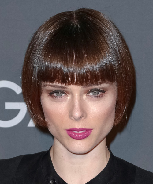 Coco Rocha with her hair in a very short and stick straight bob