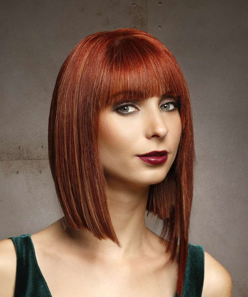 Sleek  Copper Haircut With Blunt Cut Bangs - side on view