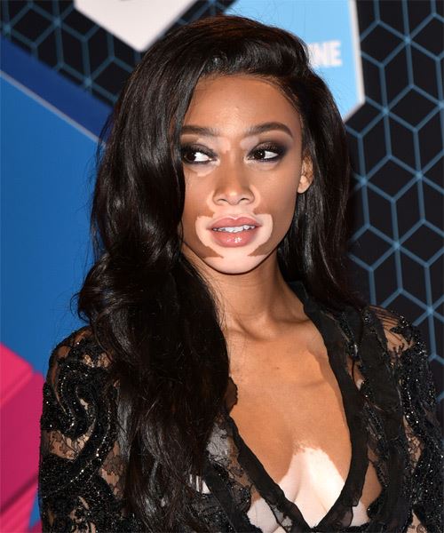 Winnie Harlow Long Wavy   Black    with Side Swept Bangs - side on view