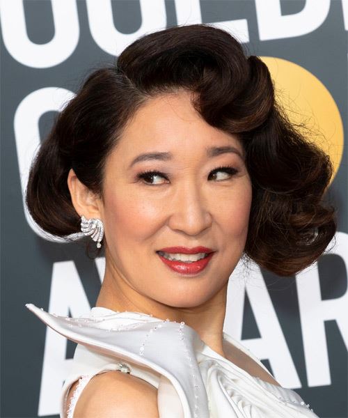 Sandra Oh Short Curly   Black  Bob  with Side Swept Bangs  and Dark Brunette Highlights - side on view
