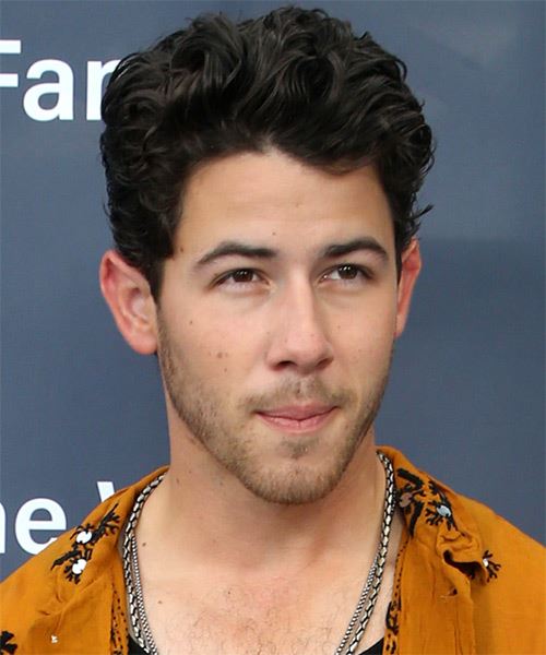 Nick Jonas Short Wavy Black Hairstyle