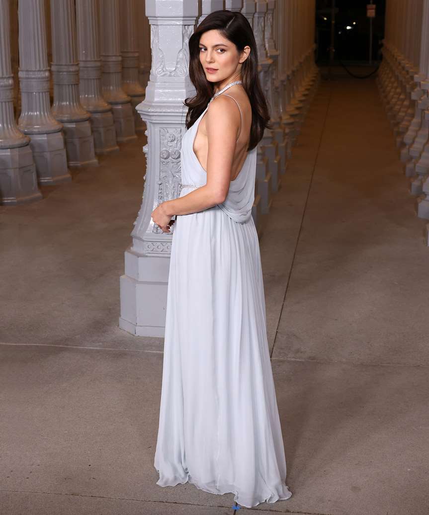 Monica Barbaro Side-Parted Hairstyle With Curled Ends - view from the side