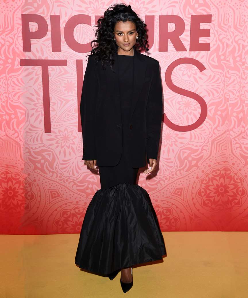 Simone Ashley Curly Hairstyle With Dramatic Side Parting - view from the side