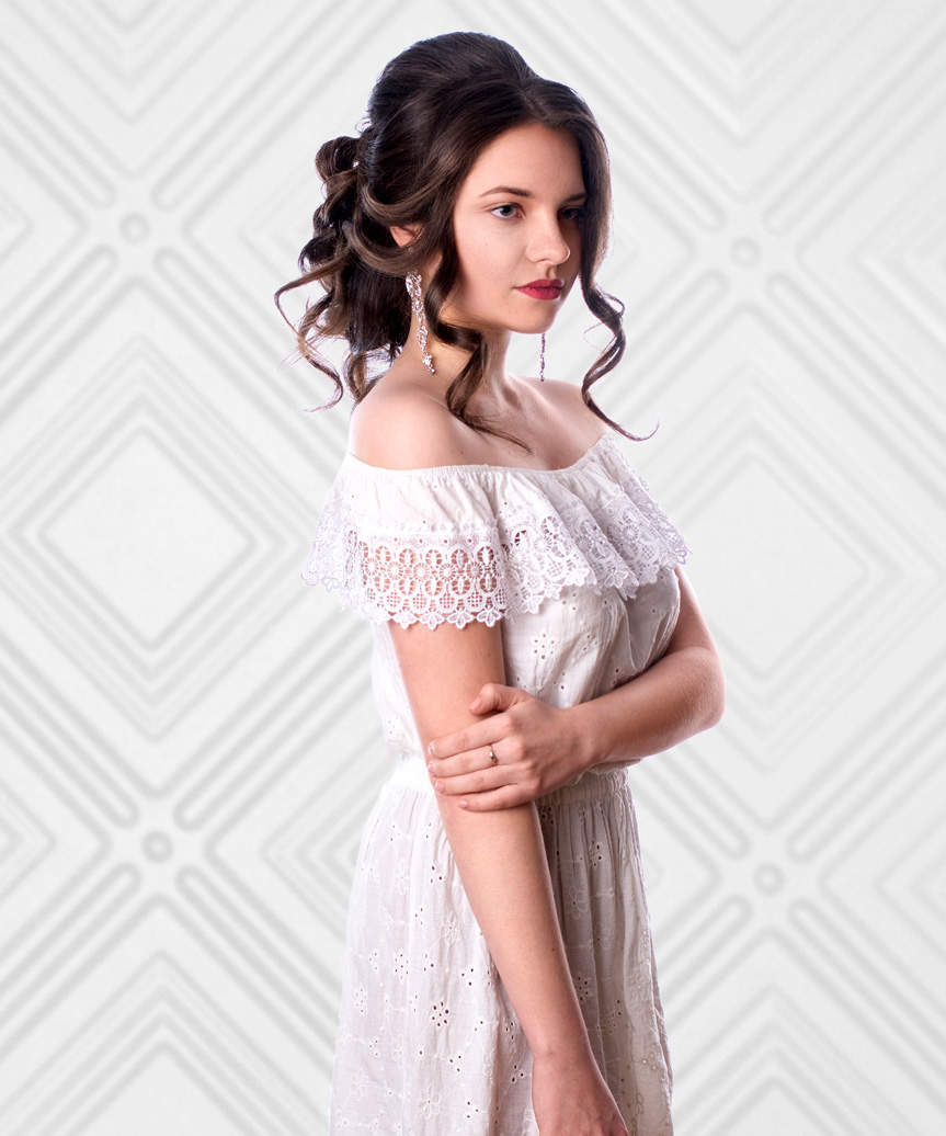 Curled Updo Hairstyle With Face-Framing Bangs - view from the side