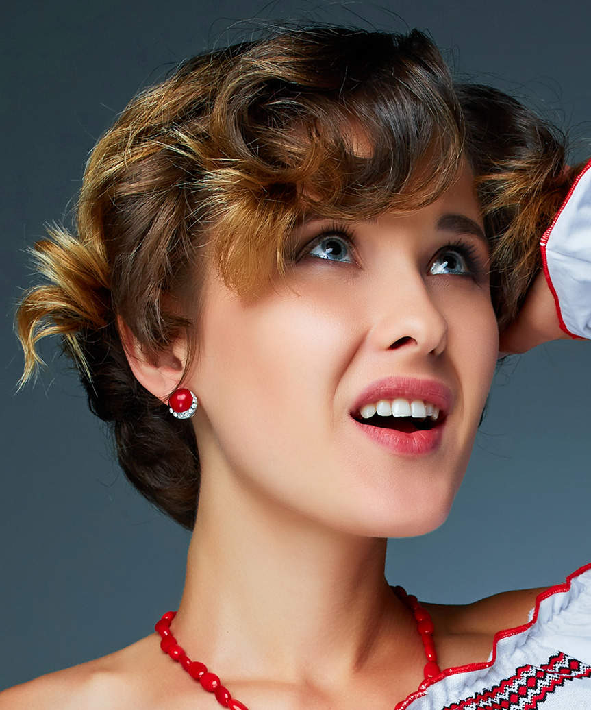 Short And Voluminous Hairstyle With Curls - view from the side