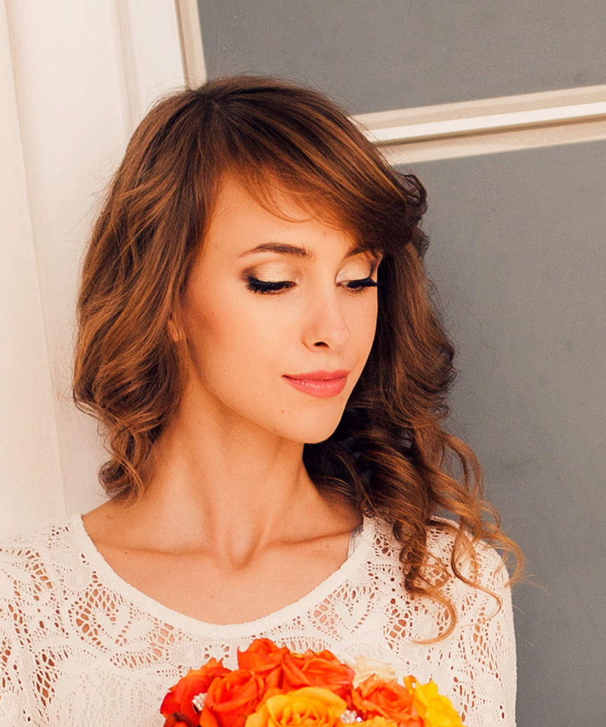 Long Hairstyle With Loose Curls And Side-Swept Bangs - view from the side