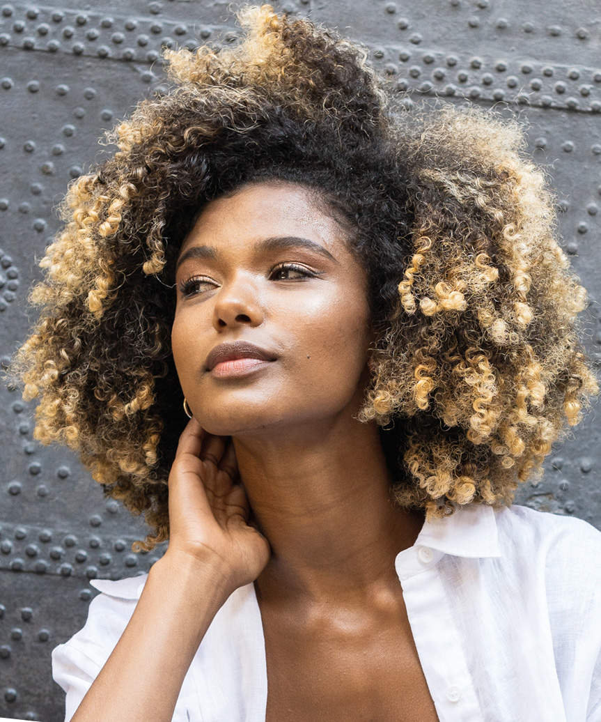 Bold Medium-Length Hairstyle With Defined Curls - view from the side