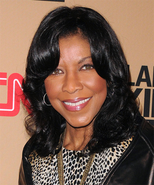 Natalie Cole Medium Wavy   Black    with Side Swept Bangs - side on view