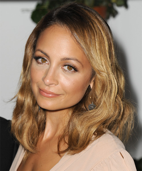 Nicole Richie Long wavy hairstyle with an eye-skimming fringe