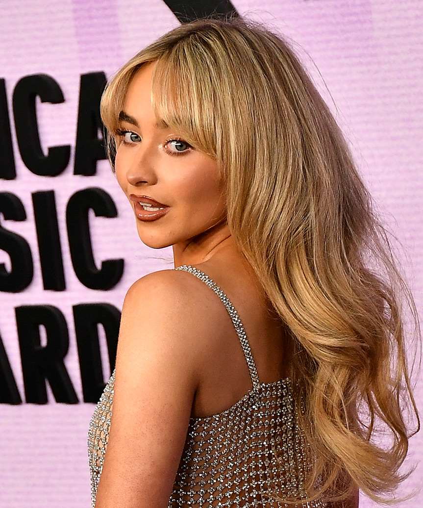Sabrina Carpenter Long Voluminous Hairstyle With Curtain Bangs Sabrina Carpenter Long Voluminous Hairstyle With Curtain Bangs