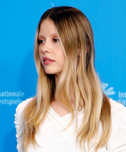 Mia Goth Long Blonde Hairstyle - side view