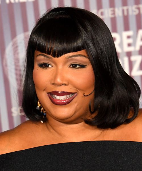 Lizzo Shoulder-Length Hairstyle With Triangle Bangs - side view