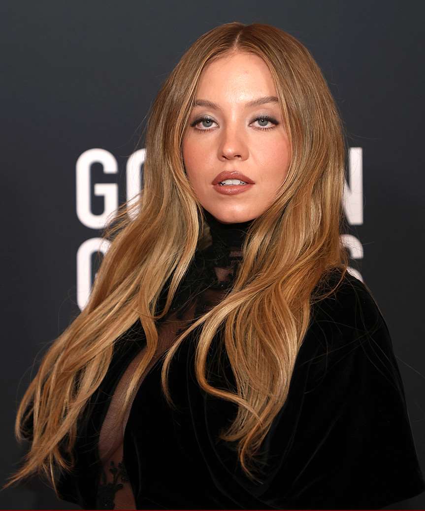 Sydney Sweeney face-Framing Hairstyle With Cascading Waves - side view