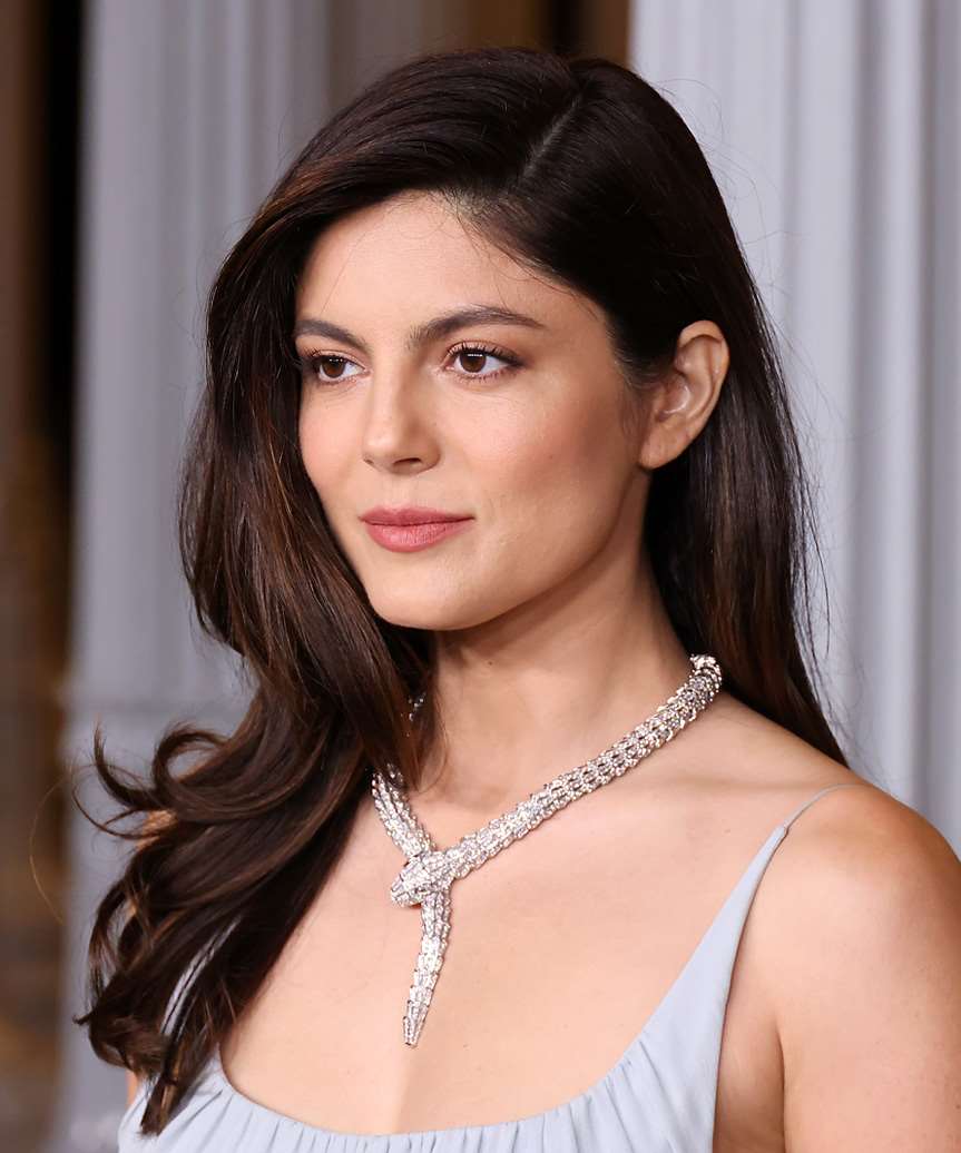 Monica Barbaro Side-Parted Hairstyle With Curled Ends - side view