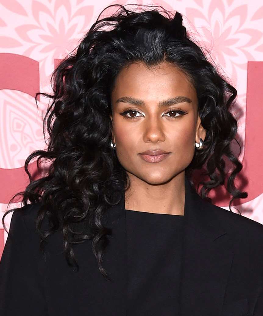 Simone Ashley Curly Hairstyle With Dramatic Side Parting - side view