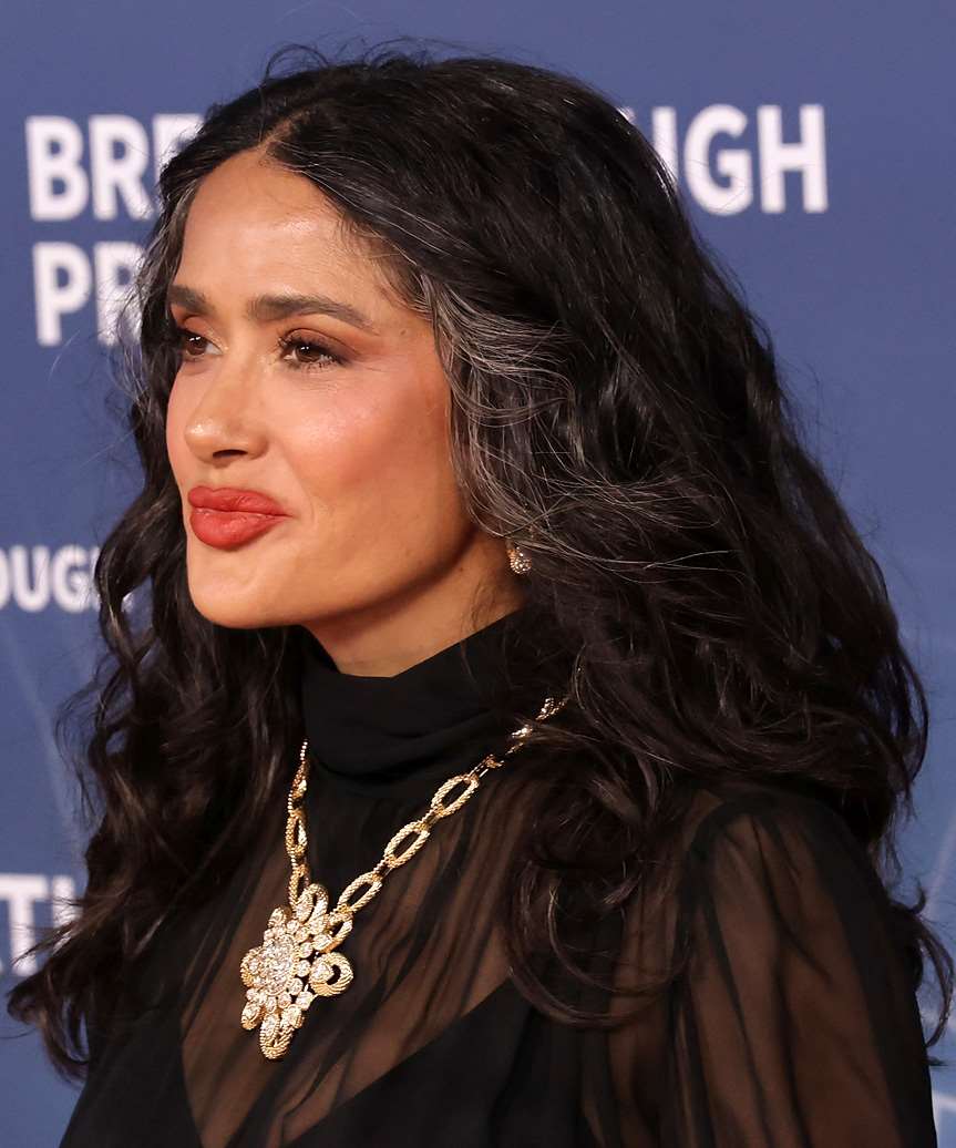Salma Hayek Curly Hairstyle With Grey Highlights - side view