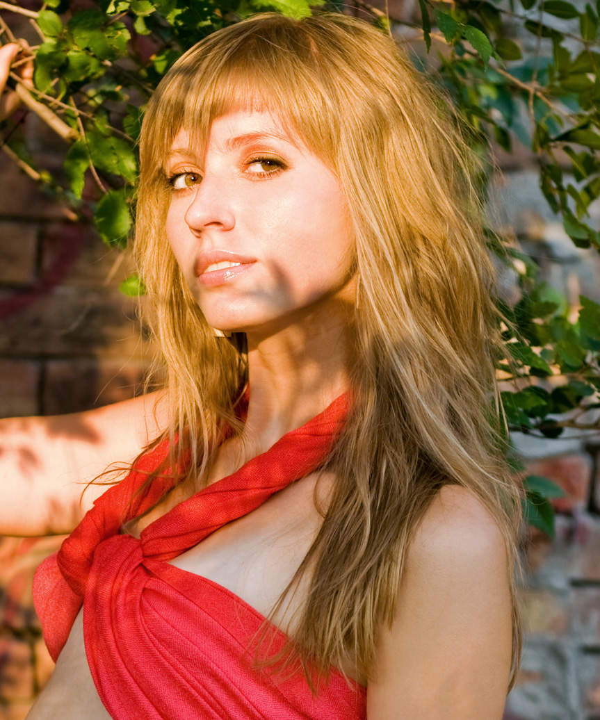 Long Face-Framing Hairstyle With Beach Waves - side view