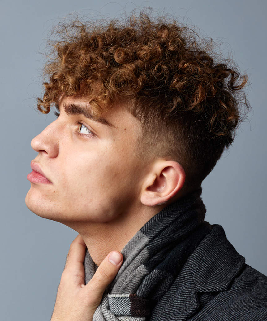 Short Male Hairstyle With Very Short Sides And Natural Curls - side view
