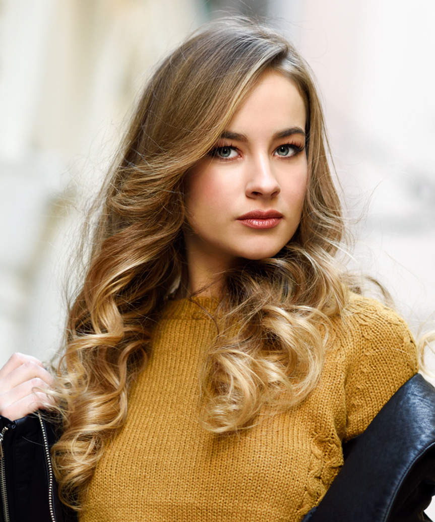 Long Hairstyle With Side-Swept Bangs And Gentle Curls - side view