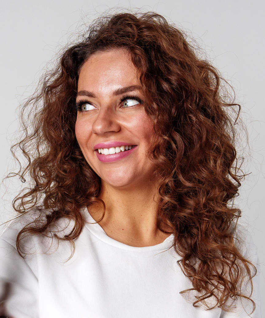 Voluminous Medium-Length Hairstyle With Natural Curls - side view