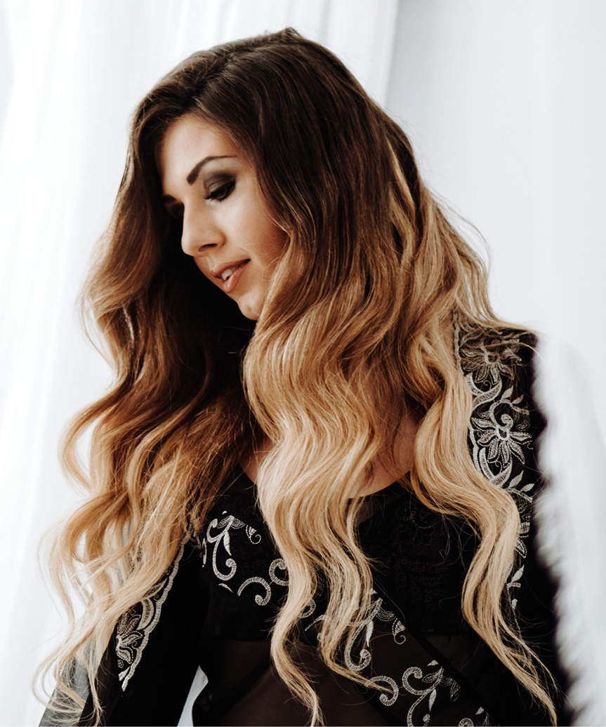 Long Two-Tone Hairstyle With Bold Curls - side view