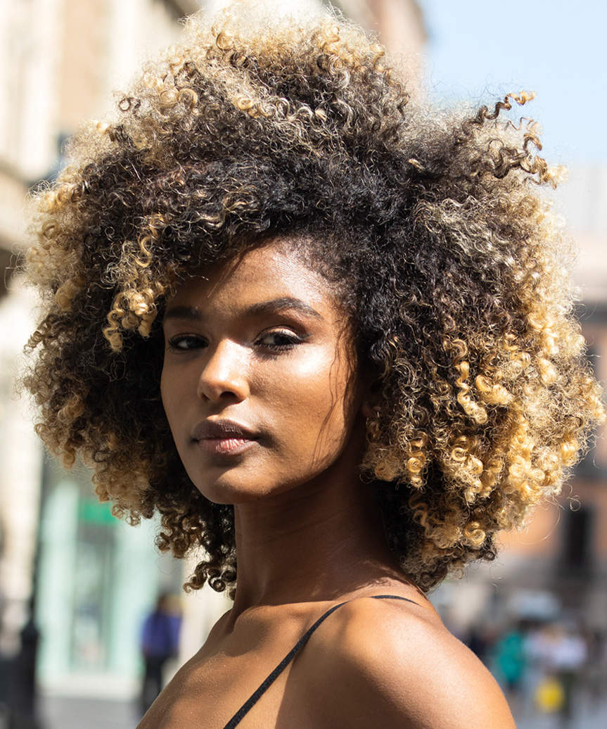 Bold Medium-Length Hairstyle With Defined Curls - side view