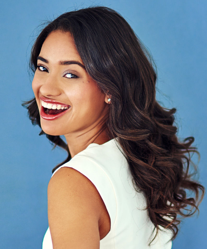 Voluminous Medium-Length Hairstyle With Soft Curls - side view
