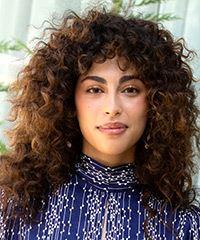 Mina El Hammani Long Curly    Brunette   Hairstyle with Side Swept Bangs  and Light Brunette Highlights