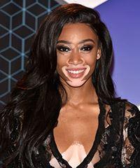 Winnie Harlow Long Wavy   Black    Hairstyle with Side Swept Bangs