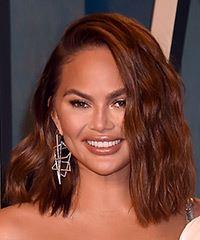 Chrissy Teigen Medium Wavy Layered   Brunette Bob  Haircut with Side Swept Bangs