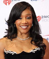 Tiffany Haddish Hairstyle With Side-Swept Bangs And Curls- Visual Story